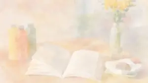 開かれた本と花瓶が置かれた、柔らかな水彩画調のデスク風景。読書量を気にせず楽しむイメージ
